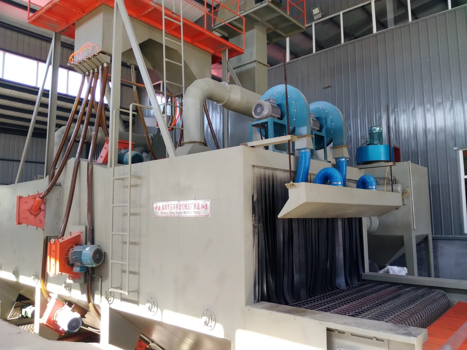 Industrial surface-treatment equipment inside a manufacturing workshop