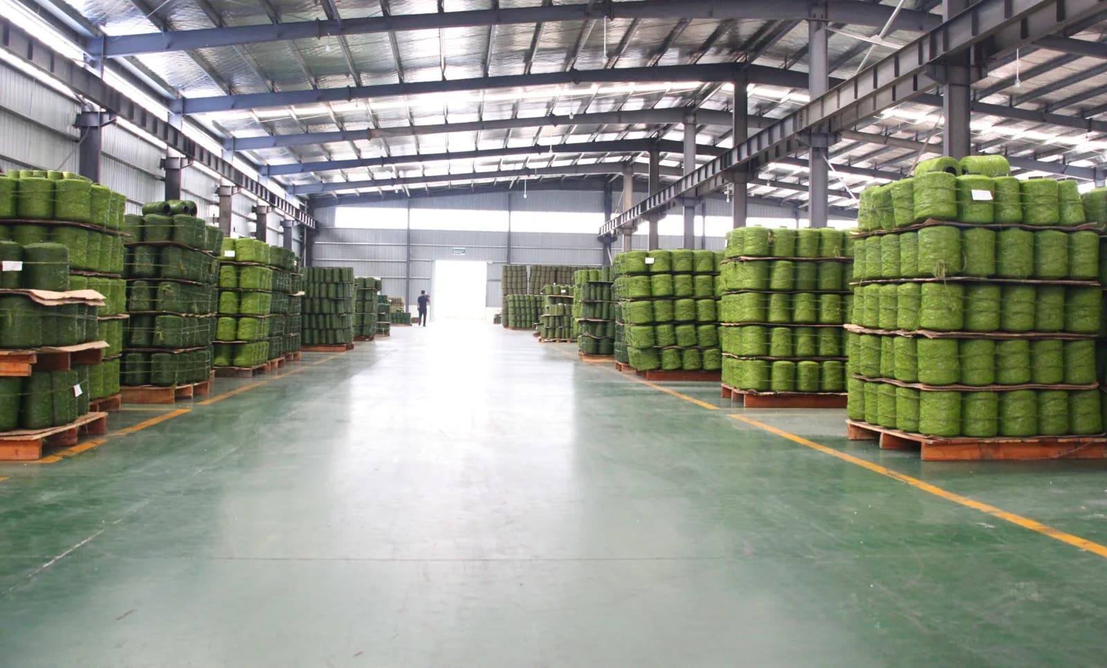 Artificial-turf rolls stored inside a warehouse