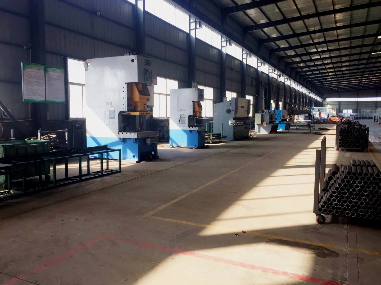 Production machines arranged along a factory workshop aisle