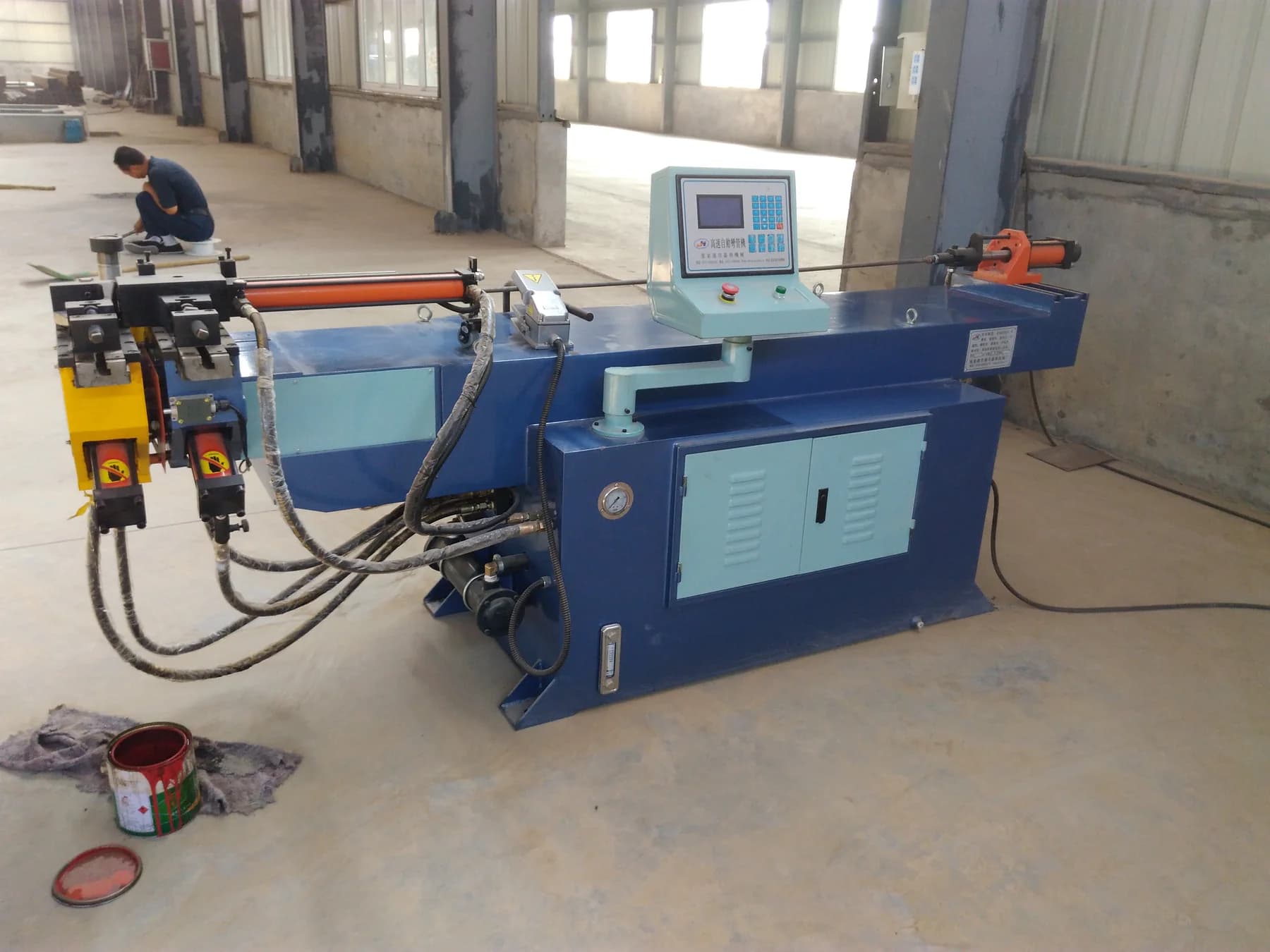 Tube-forming equipment on the factory workshop floor