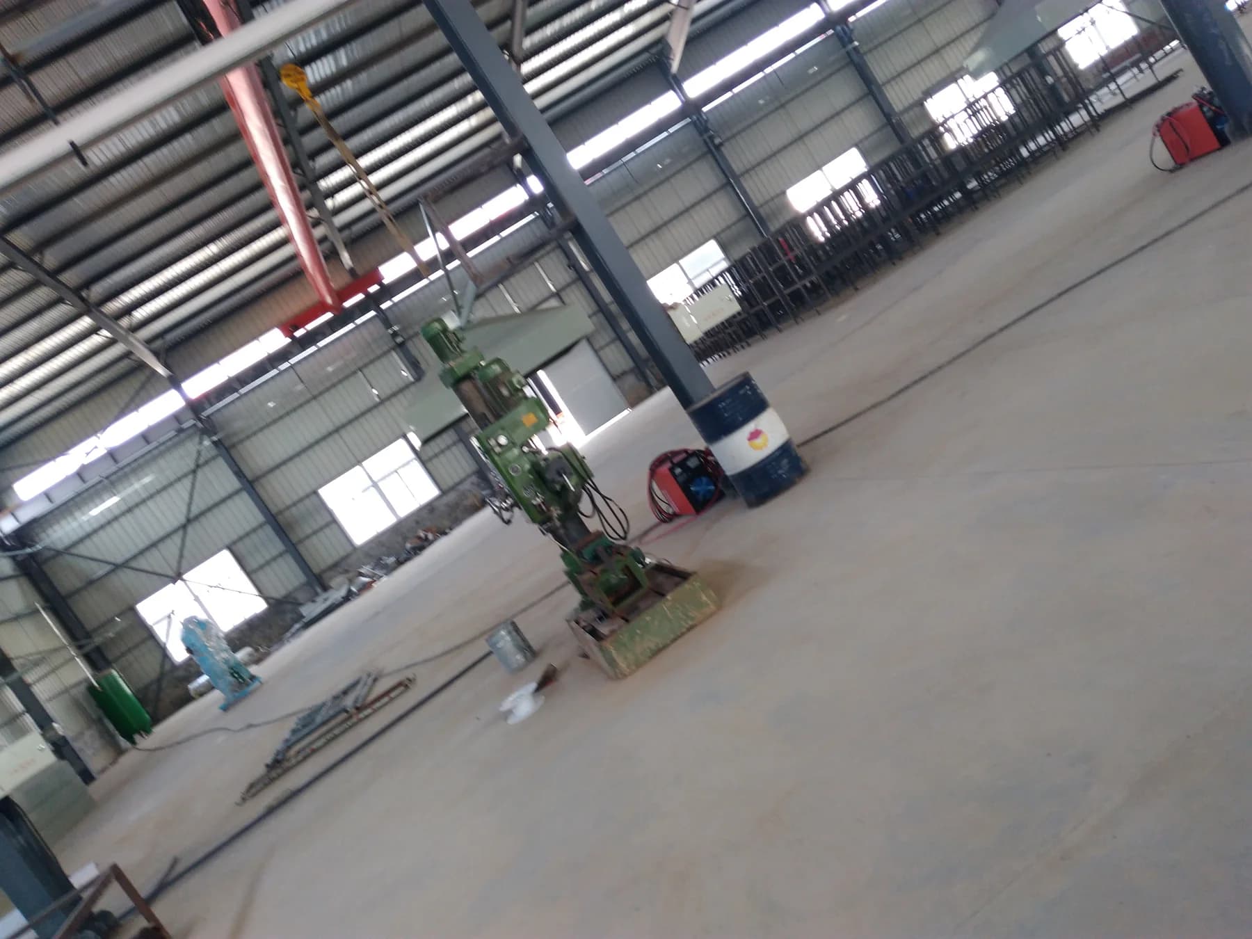 Workshop machining area with production equipment and steel frames