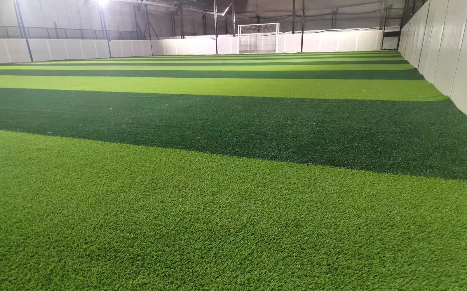 Artificial-turf playing surface inside the South America indoor football facility