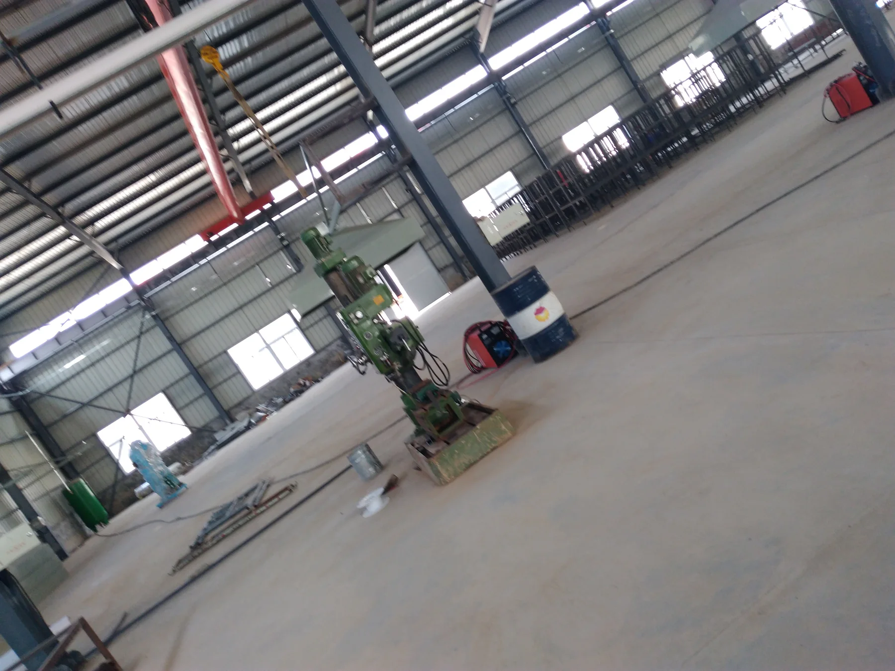 Workshop machining area with production equipment and steel frames